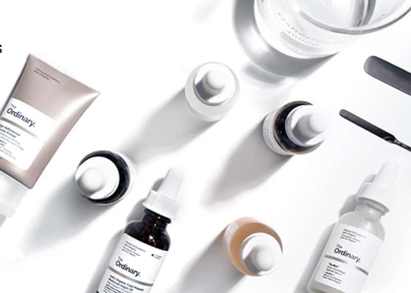 The Ordinary serums and skincare products arranged on a white surface
