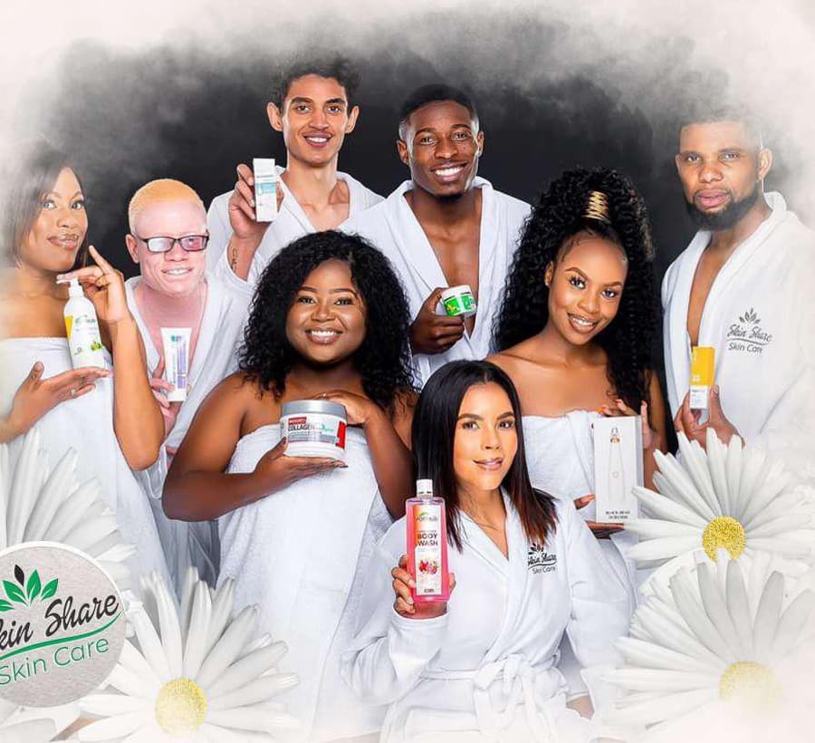 The Skincare Skinshare team in white robes holding their favourite products