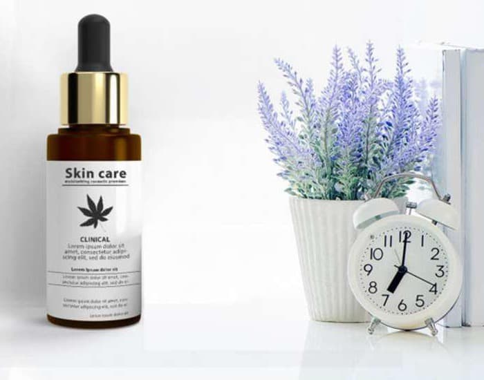 Skin care serum bottle beside lavender